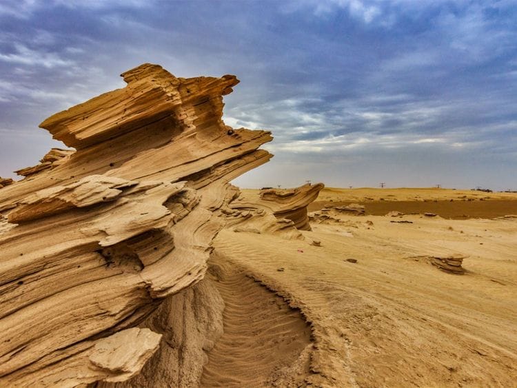 Al Wathba's twisting golden sand dunes 