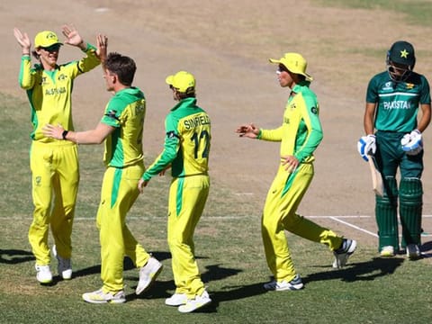 The Australian Under-19 team members jubilate at the fall of a Pakistan wicket on Friday.
