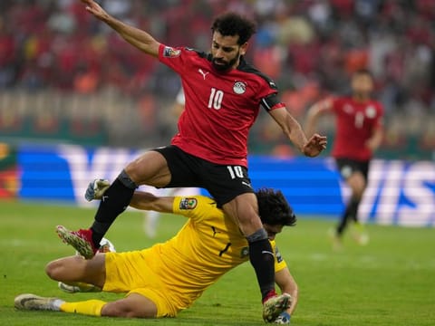 Egypt's Mohamed Salah collides with Morocco's goalkeeper Yassine Bounou, as he attempts a goal shot during the African Cup of Nations 2022 quarter-final match at the Ahmadou Ahidjo stadium in Yaounde, Cameroon.