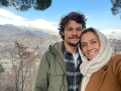 In this recent photo provided by Charlotte Bellis, Bellis poses in a selfie with her partner Jim Huylebroek in Kabul, Afghanistan. Bellis, a pregnant New Zealand reporter who is expecting her first child with Huylebroek, has chosen Afghanistan as a temporary base for her uphill fight to return home because of her country's stringent COVID-19 entry rules. Huylebroek, a freelance photographer and Belgium native, has lived in Afghanistan for two years.