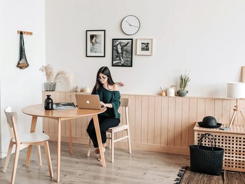 A round table with some plants will definitely help create a sense of 'green care' around your desk space