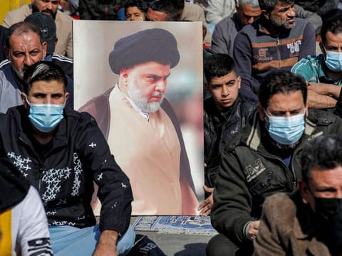 Supporters of Iraqi Shiite Muslim cleric Moqtada Al Sadr perform the weekly Friday prayers in the Sadr City suburb of Iraq's capital Baghdad on January 28, 2022. 