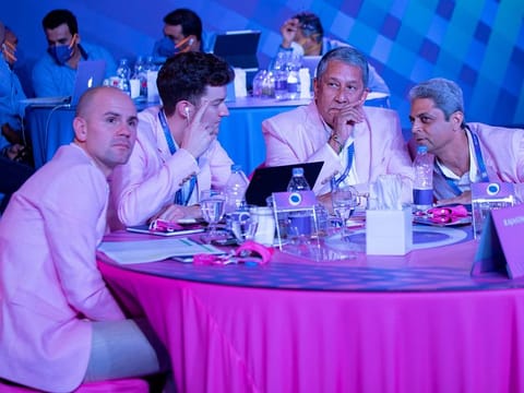 Auction time: Members of Rajasthan Royals and Mumbai Indians (background) are in the middle of an IPL auction.