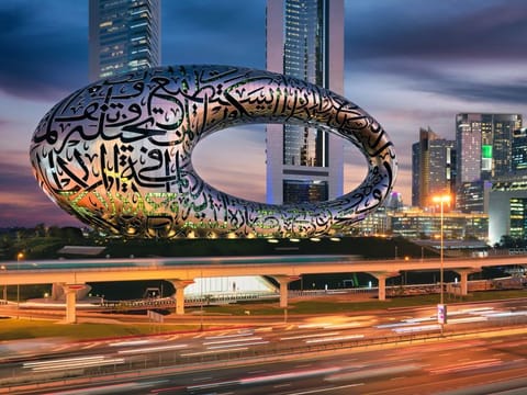 At night, the Arabic script windows of the Museum of the Future illuminate the city’s iconic skyline with 14km of energy-saving LED lights