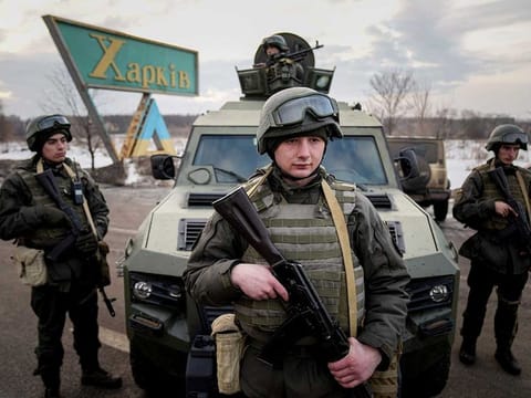 Ukrainian National guard soldiers guard a mobile checkpoint together with the Ukrainian Security Service agents and police officers during a joint operation in Kharkiv, Ukraine, Thursday, Feb. 17, 2022. 