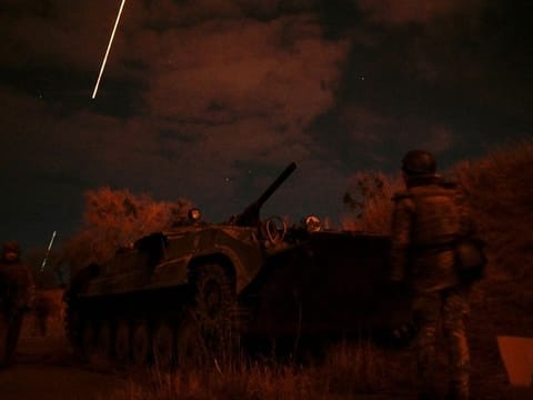 Ukrainian servicemen take positions at the military airbase Vasylkiv in the Kyiv region, Ukraine.
