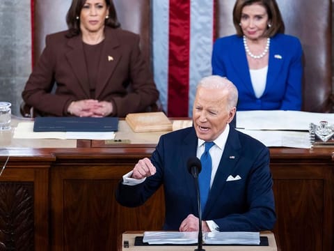 President Joe Biden delivers his first State of the Union address to a joint session of Congress at the Capitol, Tuesday, March 1, 2022, in Washington as Vice President Kamala Harris and House speaker Nancy Pelosi of California., look on. 
