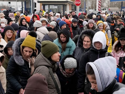 Refugees fleeing the war from neighbouring Ukraine arrive at the border crossing in Palanca, Moldova.