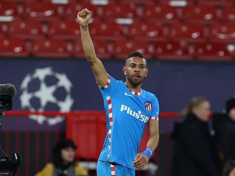 Atletico Madrid's Renan Lodi celebrates after the match.