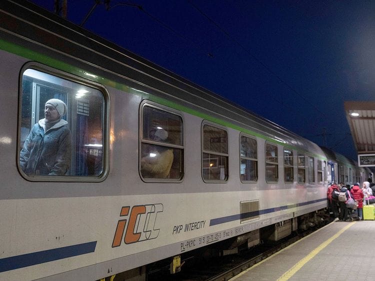 File photo: Ukrainian refugees embark a train bound to Warsaw, at the Przemysl train station, southeastern Poland, on March 11, 2022. 