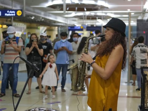 Monique, South African, performs during the Dubai Metro Music Festival at Union metro station on the second day of Dubai Metro Music festival 2022.