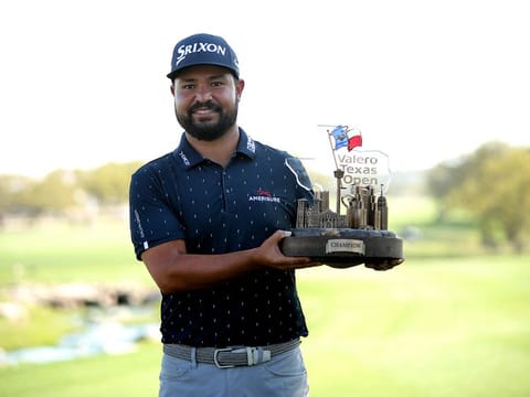 J.J. Spaun of United States displays his Texas Open winner's trophy on Sunday.