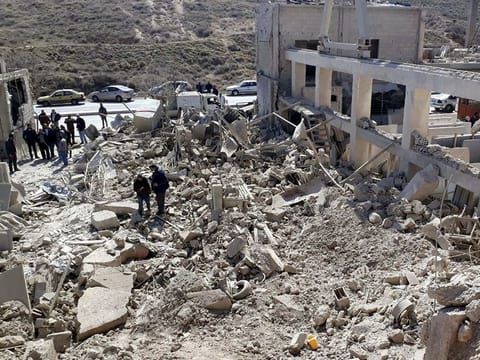 File picture: Men inspect damage after Syria State Media reported an Israeli attack in Damascus, Syria, in this handout released by SANA on March 7, 2022.