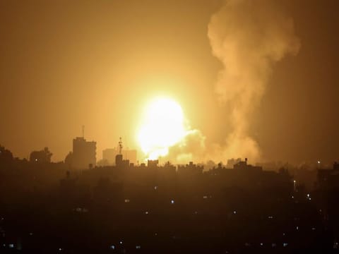 An explosion is caused by Israeli airstrikes on a Hamas military base in town of Khan Younis, southern Gaza Strip, Tuesday April 19, 2022. 