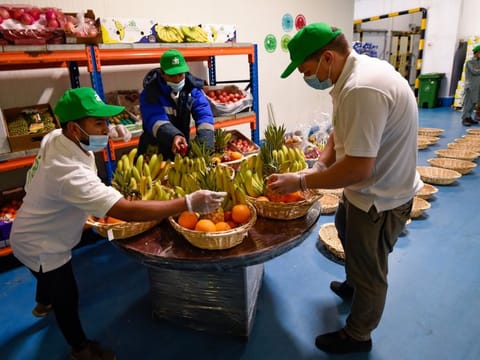 Workers packing fruit baskets  for "One Million Meals from Waste Food" campaign, which joined the efforts of the Billion Meals Initiative to provide food support to the poor and needy. Photo: Virendra Saklani/Gulf News