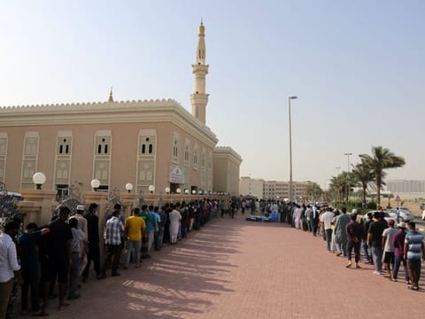 People start lining up around 4pm at the mosque, more than two hours before iftar, for the meal distribution  