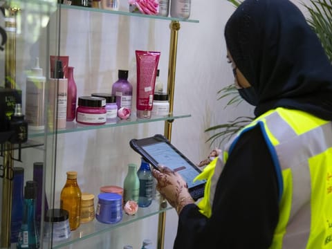An inspector from Dubai Municipality during an inspection of a salon ahead of Eid Al Fitr.