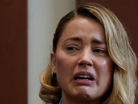 Actor Amber Heard testifies about the first time her ex-husband, actor Johnny Depp hit her, at Fairfax County Circuit Court during a defamation case against her by Depp in Fairfax, Virginia, U.S., May 4, 2022.