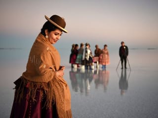 Bolivian boy turns photographer on iconic salt flats - with help from a dinosaur