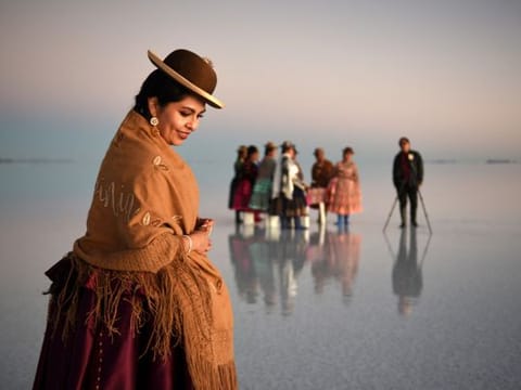 Bolivian boy turns photographer on iconic salt flats - with help from a dinosaur