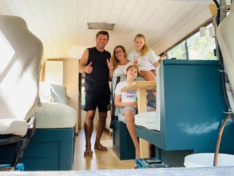 The Schakat family members inside their customised bus.