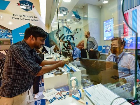 Customers at Lulu Exchange in Sharjah. New guidelines allow resident Indians to receive more money from their NRIs staying overseas, without having to inform the authorities.