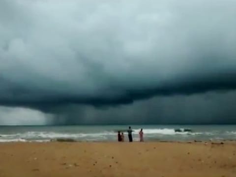 Dark clouds hover over the shore, in view of Cyclone Asani, in Srikakulam, Andhra Pradesh, on Tuesday. 