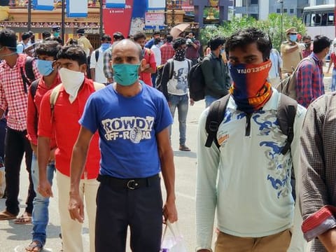 Migrants being screened as they arrive at Aluva station, Kerala.