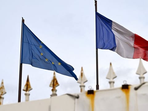 Flags of France and the European Union fly outside at the French embassy in Moscow on May 18, 2022. Moscow on May 18, 2022 kicked out diplomats from France, Italy and Spain in retaliation for the expulsion of Russian diplomats from European countries as part of a joint action against Russia's campaign in Ukraine. 