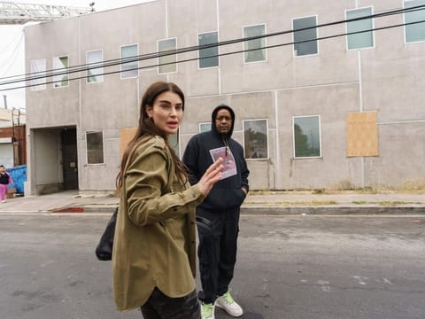 English actress and singer Aimee Osbourne, who creates electropop music under the name ARO, left, thanks music producer Jamal Rajad Davis, outside a Hollywood recording studio in Los Angeles Friday, May 20, 2022 in Los Angeles.