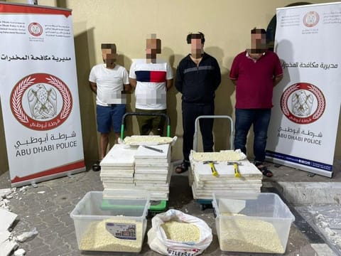 The arrested drug traffickers. 