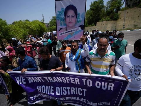 Employees of Jammu and Kashmir Teachers Association shout slogans during a protest against the killing of colleague Rajini Bala in Jammu, on June 2, 2022.  