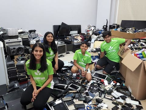 Riva Tulpule (L) with the WeCareDXB team and the e-waste they collected