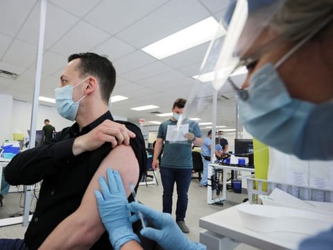 A man is vaccinated at a monkeypox vaccination clinic run by CIUSSS public health authorities in Montreal, Quebec, June 6, 2022.   
