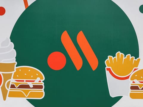 A banner with the logo of the new restaurant chain, in Moscow.