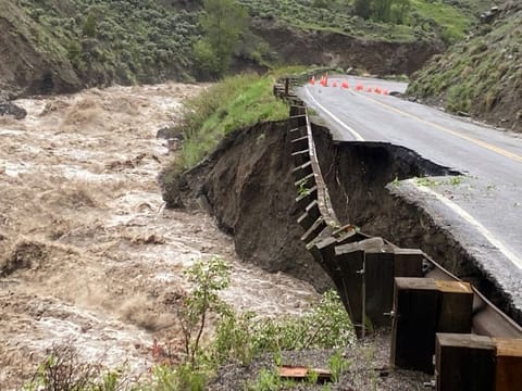 High water levels in the Gardner River erode Yellowstone National Park's North Entrance Road, where the park was closed due to heavy flooding, rockslides, extremely hazardous conditions near Gardiner, Montana.