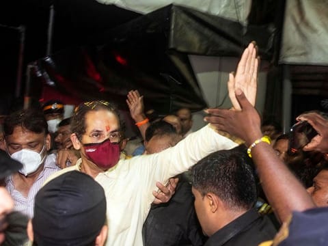 Maharashtra Chief Minister and Shiv Sena chief Uddhav Thackeray waves to the party supporters on his arrival at his residence 'Matoshree', Bandra, in Mumbai.  