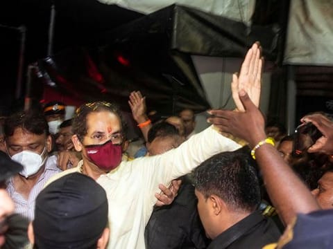 Maharashtra Chief Minister and Shiv Sena chief Uddhav Thackeray waves to the party supporters on his arrival at his residence 'Matoshree', Bandra, in Mumbai.  