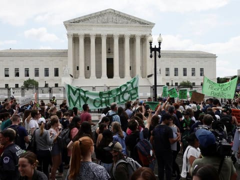 Activists outside the United States Supreme Court as the court rules in the Dobbs v Women’s Health Organization abortion case, overturning the landmark Roe v Wade abortion decision in Washington, U.S., June 24, 2022.