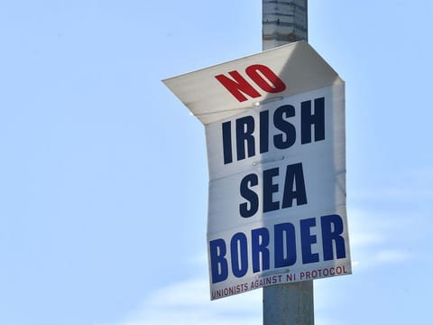A poster at the port in Larne, Northern Ireland, on June 20, 2022. Under the Post-Brexit Northern Ireland protocol, continued access to the European Union’s single market at the expense of the rest of the United Kingdom is proving beneficial for the region’s exporters in tougher economic times. 