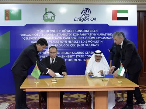 Officials from Dragon Oil and Turkmenistan sign the 10-year, $1 billion deal extension.