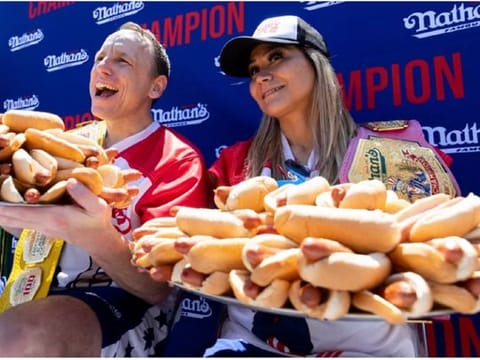 Chowdown: He ate 63 hot dogs in 10 minutes, she ate 40