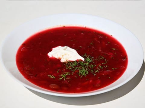 Beetroot borscht soup with sour cream. The United Nation's cultural agency inscribed the culture of cooking borscht soup in Ukraine on its list of endangered cultural heritage on July 1, 2022. Russia denounced Unesco decision to recognise borscht soup as part of Ukraine's national heritage.  