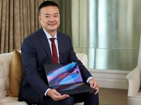 Jeff Lo, Regional Head of Asus Middle East, poses with the brand's Zenbook Pro laptop