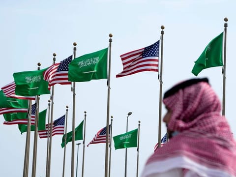 American and Saudi Arabian flags prior to a visit by US President Joe Biden, at a square in Jeddah, Saudi Arabia, on July 14, 2022. 