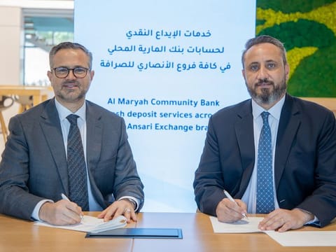 Al Maryah Community Bank and Al Ansari Exchange sign an agreement