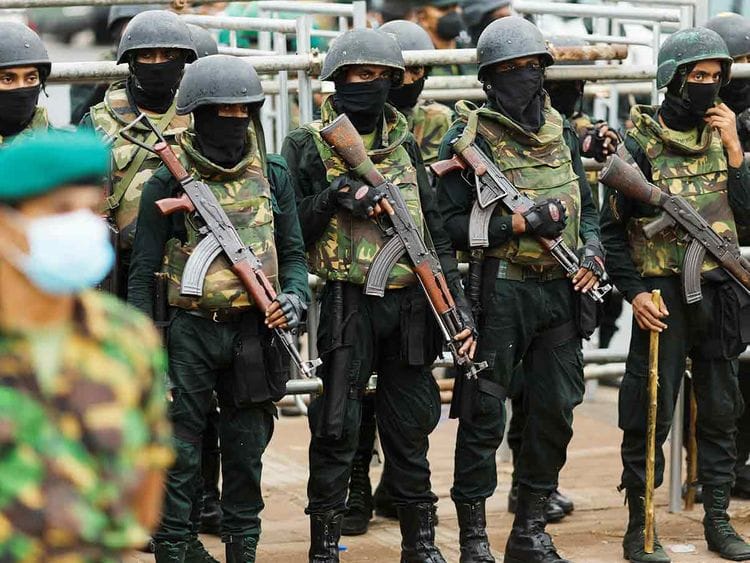 Security personnel stand guard near the Presidential Secretariat