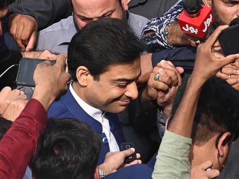 Hamza Shehbaz (C), the leader of Pakistan Muslim League-Nawaz (PML-N), arrives at the provincial assembly in Lahore on July 22, 2022.  