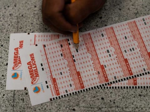 A player fills out Mega Millions playslips in Hawthorne, California. File photo taken on Tuesday, July 26, 2022.  