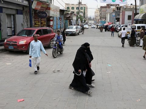 People walk on a street in Sanaa, Yemen August 1, 2022. 